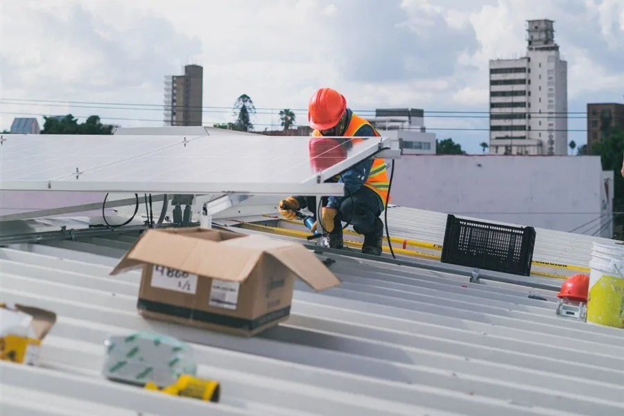 Roof repair worker on a metal roof in Melbourne